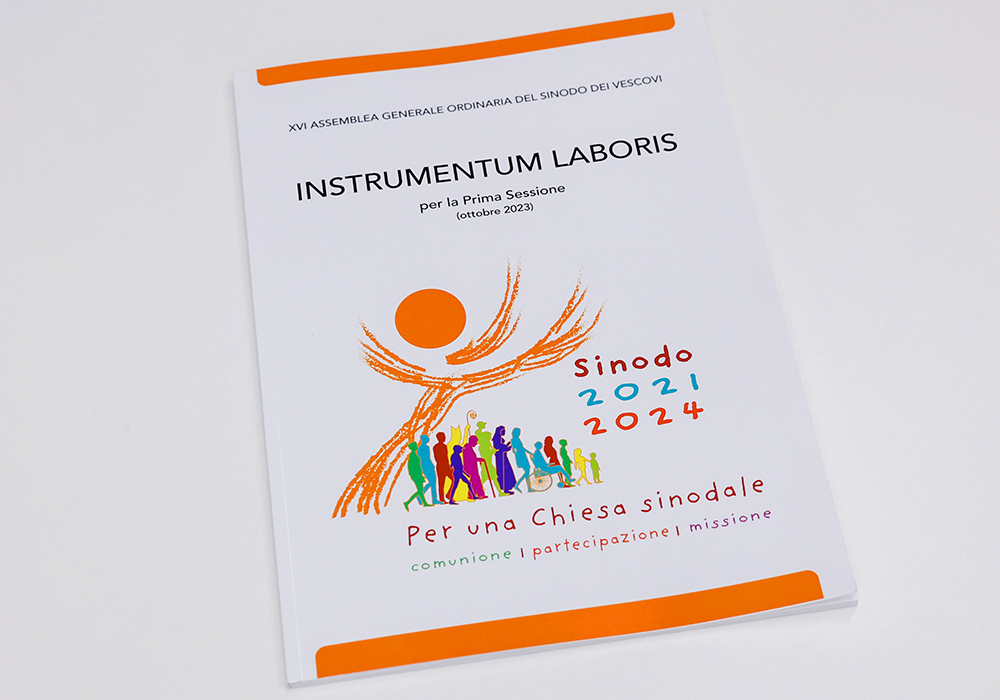 A printed copy of the instrumentum laboris, or working document, for the world Synod of Bishops on synodality is seen in the Vatican press office June 20. (CNS/Lola Gomez)